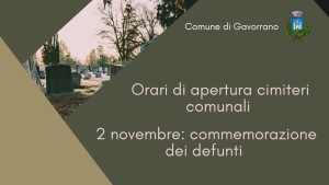 Sfondo scuro, immagine di un cimitero, scritta ORARI CIMITERI - 2 NOVEMBRE GIORNATA COMMEMORAZIONE DEFUNTI